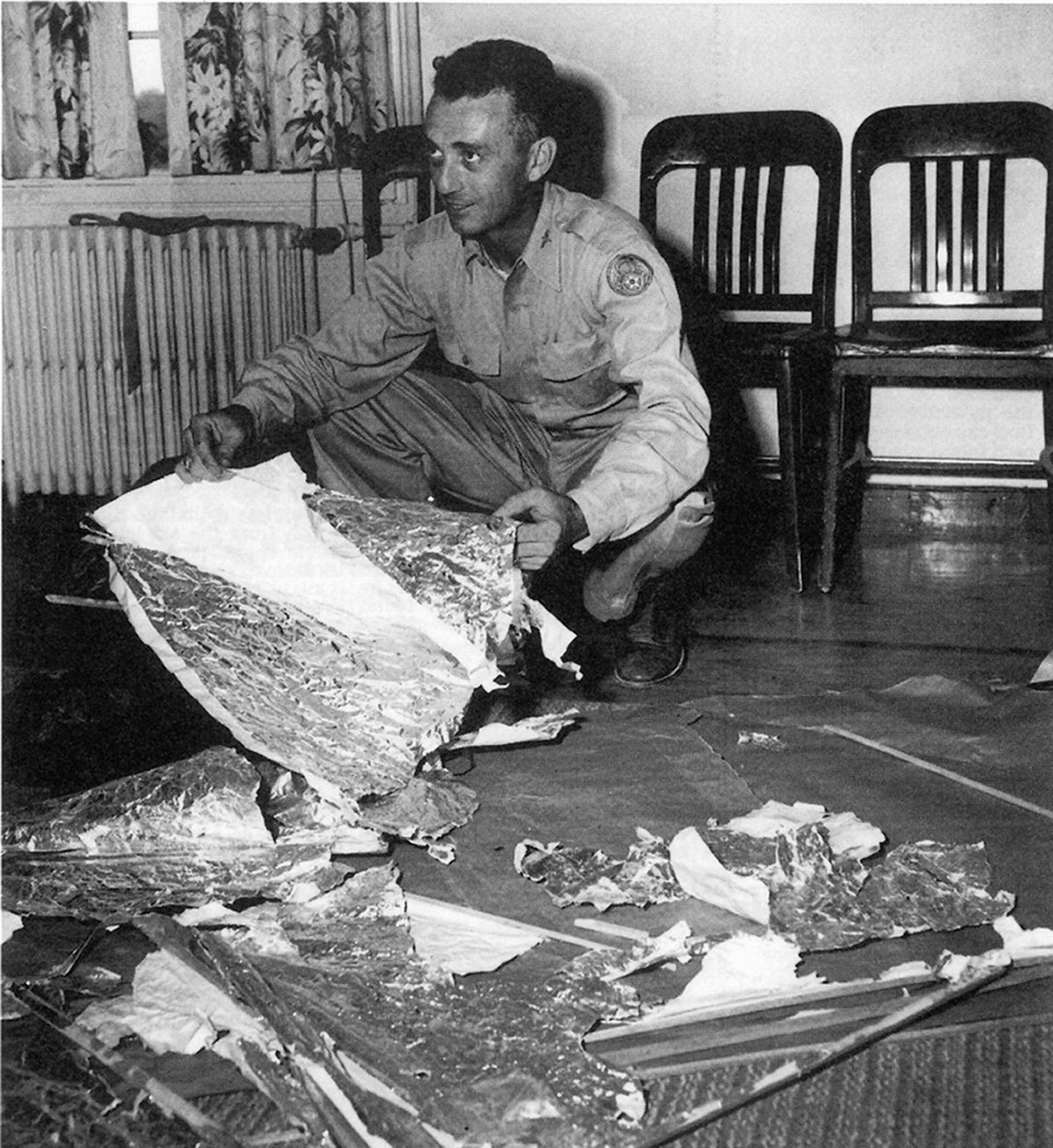 Major Jesse Marcel with debris from the Roswell UFO crash of 1947